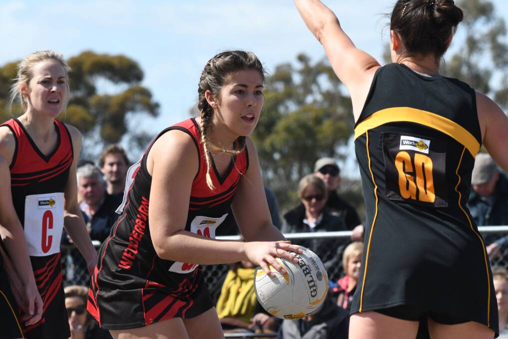 FUTURE: Nikki Lockhart takes control during last year's North Central A-grade premiership win for Wedderburn. The Redbacks' football, netball and hockey clubs have merged.