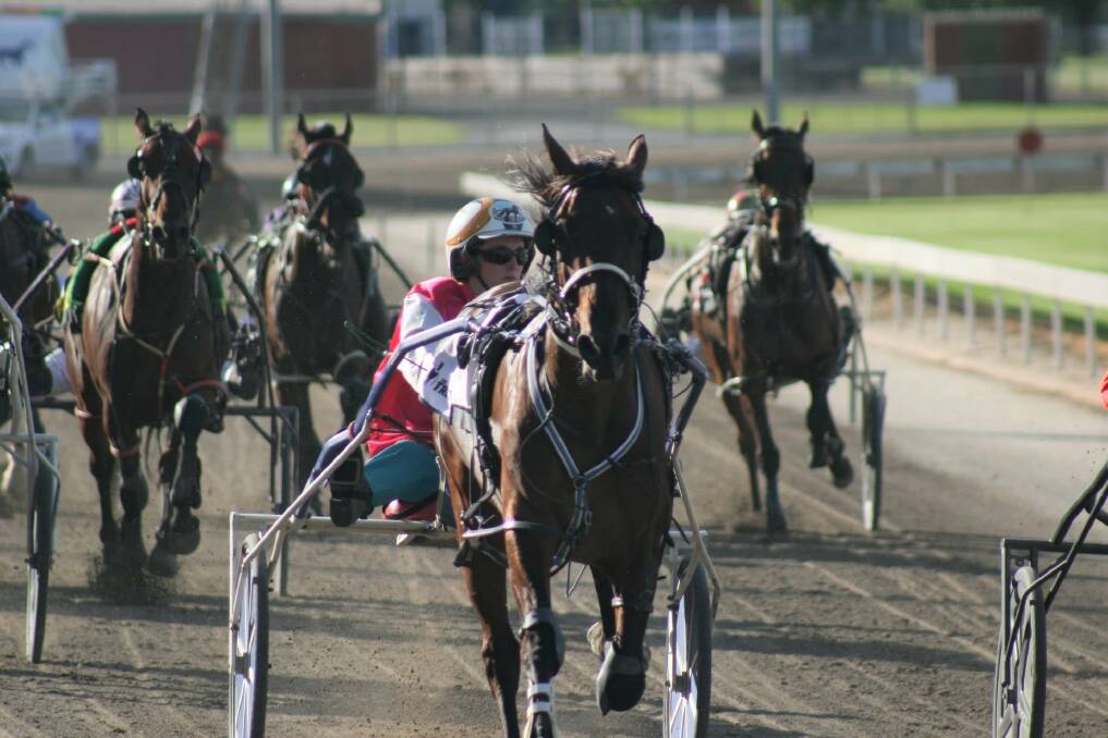 TERRIFIC IN TEAL: Ellen Tormey steers the Glenn Douglas-trained Selaphobia to victory at Mildura's City Oval Paceway last Tuesday night. The Junortoun trainer has contributed eight winners so far to this year's Team Teal campaign. Picture: CHARLI MASOTTI PHOTOGRAPHY