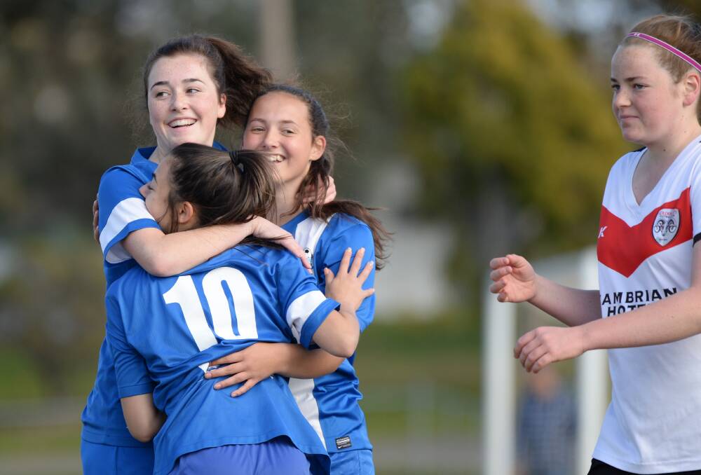 STRIKE: Cayla Ruijters, Caitlin Georgiou and Sophie Papalia (#10) celebrate one of Shepparton United's 10 goals against BASL rival Golden City. Pictures: GLENN DANIELS