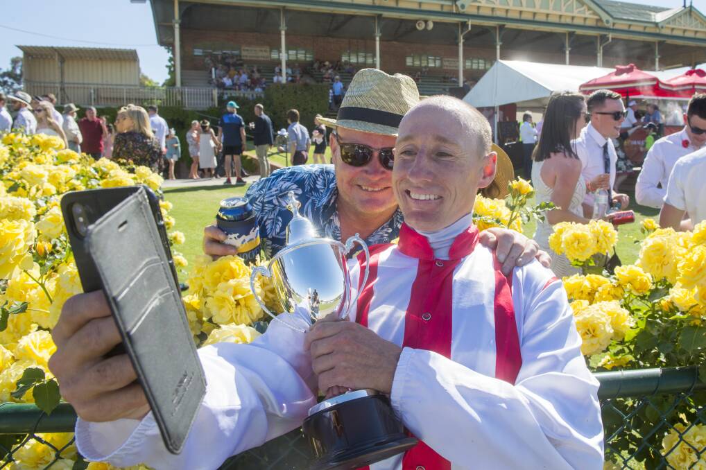 GLAD TO BE BACK: Champion jockey William Pike takes a selfie for a fan following his win aboard Top Of The Range in last year's Group 3 Bendgo Cup. Picture: DARREN HOWE