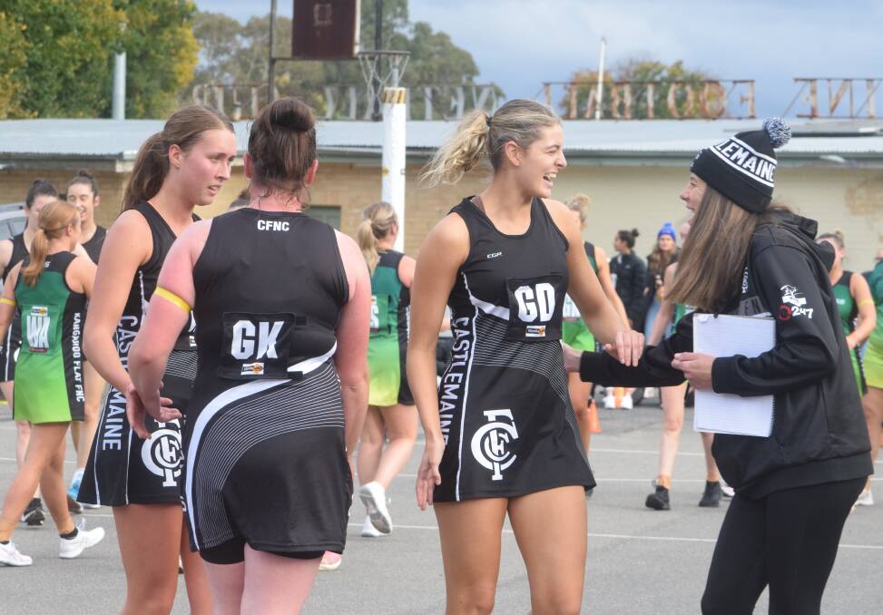 Castlemaine co-coach Fiona Fowler and surprise Magpie Gabby Coffey share a lighthearted moment at quarter time of Saturday's BFNL A-grade clash against Kangaroo Flat at Camp Reserve. Picture: KIERAN ILES
