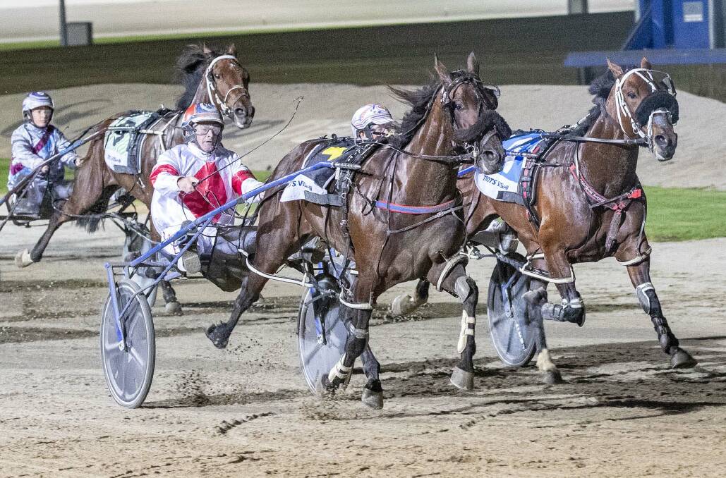 A NIGHT TO REMEMBER: Denny Rocks, driven by John Caldow, charges to victory in the Alabar Vicbred Platinum Home Grown Classic for three-year-old colts and geldings at harness racing headquarters on Saturday night. It was the first of two Group 2 wins on the night for Elmore trainer Keitch Cotchin. Picture: STUART McCORMICK