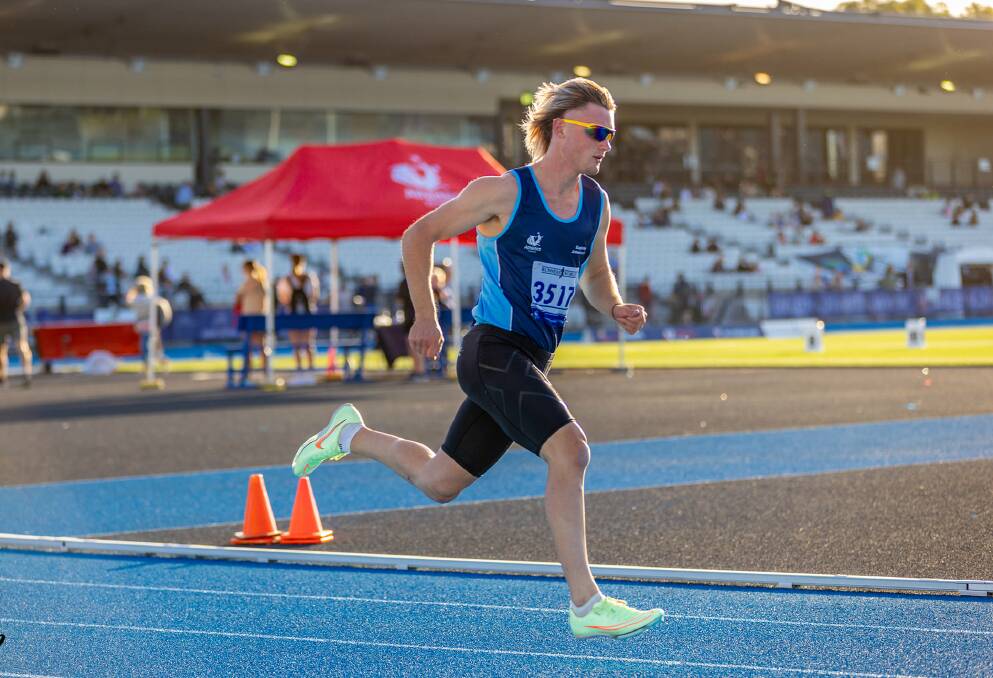 Eaglehawk's Angus McKindlay sprints around the Lakeside track during the Athletics Victoria state open and under-age track and field championships.