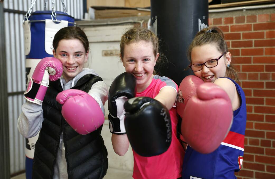 Chloe Lenaghan, Milli Woods and Alexia Woods prepare for Bendigo Blue Light boxing at the Hit Factory in September 2016. Picture: EMMA D'AGOSTINO
