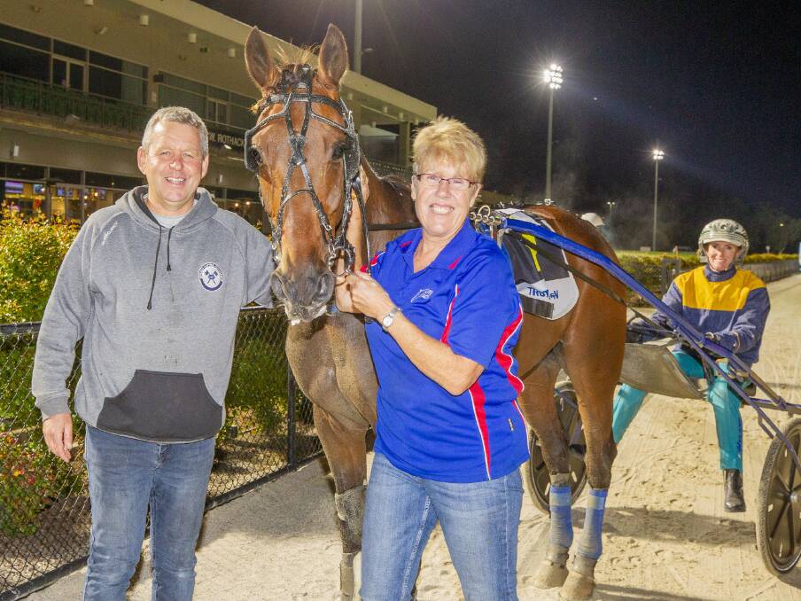 Dean Goodridge, Carla Innes-Goodridge and Ellen Tormey with Zarem following the six-year-old trotter's thrilling win at Tabcorp Park Melton on Saturday night. Picture: STUART McCORMICK