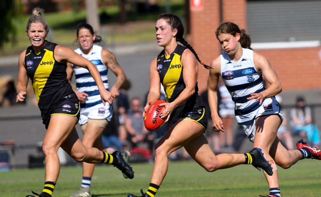 FIGHTING SPIRIT: Grace Campbell, pictured in action for Richmond against Geelong at the QEO, is at the centre of the battle against coronavirus. Picture: NONI HYETT