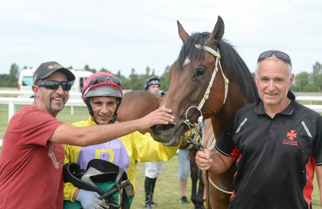 Charles Cassar (left) celebrates Factually's win at Camperdown. Picture by Ross Holburt/Racing Photos