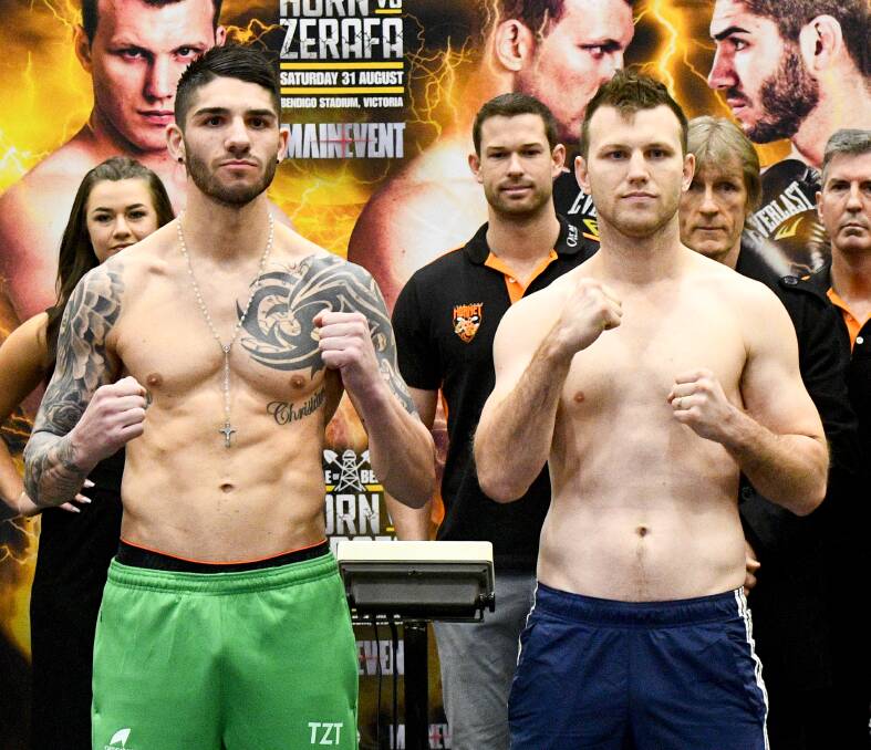 READY TO RUMBLE: Challenger Michael Zerafa and WBA Oceania middleweight champion Jeff Horn at Friday's weigh-in at Bendigo Stadium. The pair will main event a huge eight-fight Battle of Bendigo card on Saturday night. Picture: NONI HYETT