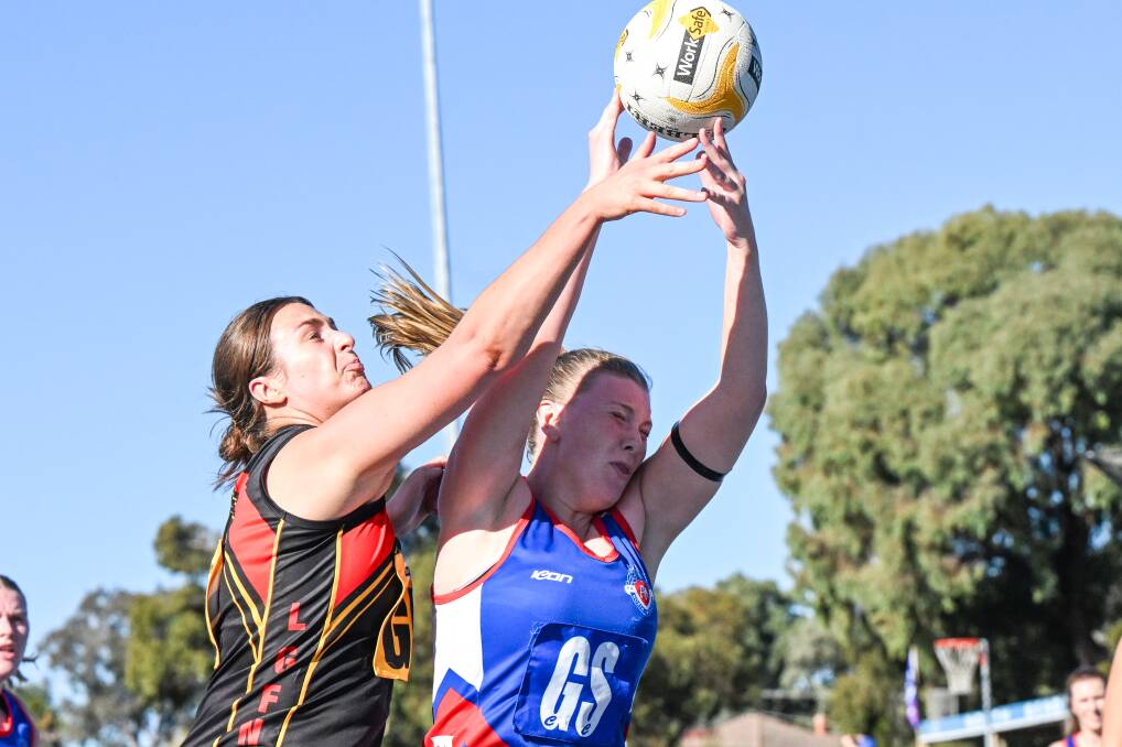 Leitchville-Gunbower's Claudia Collins applies the heat to North Bendigo goal shooter Morgan McClellan during Saturday's round three clash at Atkins Street. Picture by Darren Howe