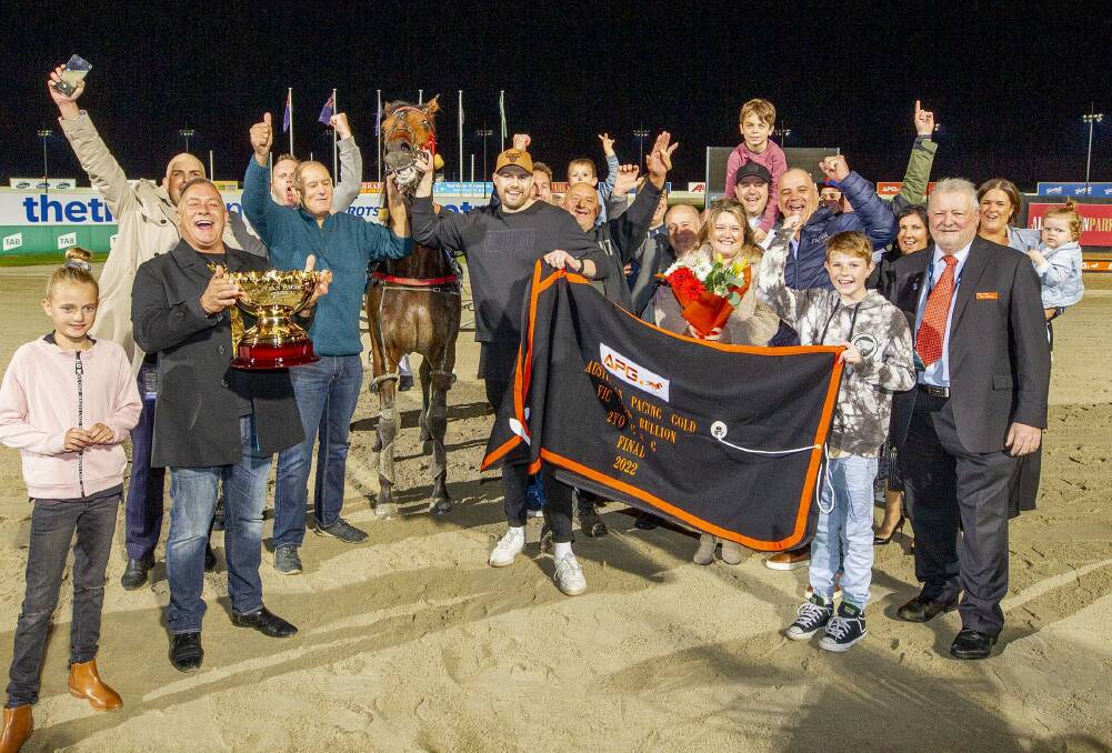 The connections of Mister Hunter celebrate Group 1 success at Tabcorp Park Melton on Saturday night. Picture: STUART McCORMICK