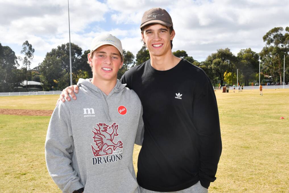 CONFIDENT: Sam Conforti with his good mate and former Bendigo Pioneer Flynn Perez. The pair lent their support to a football clinic for children at St Therese's in Kennington this week. Picture: NONI HYETT