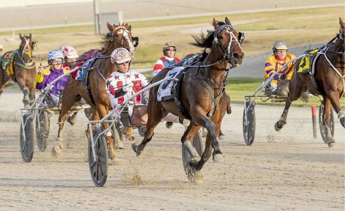 Watts Up Majestic, trained and driven by Chris Svanosio, charges to victory in the Group 1 Breeders Crown final for two-year-old trotting colts and geldings at Tabcorp Park Melton on November 21. Picture: STUART McCORMICK