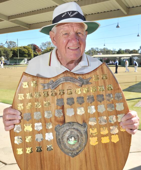 Victorian team president Graeme Thies holds the Meat Traders Interstate Bowls Carnival shield at the Kangaroo Flat Bowls Club.