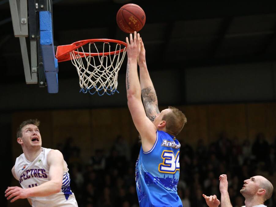 SEALER: Matt Andronicos puts the icing on the victory cake with two points in the final minutes of the grand final clash against Nunawading Spectres.