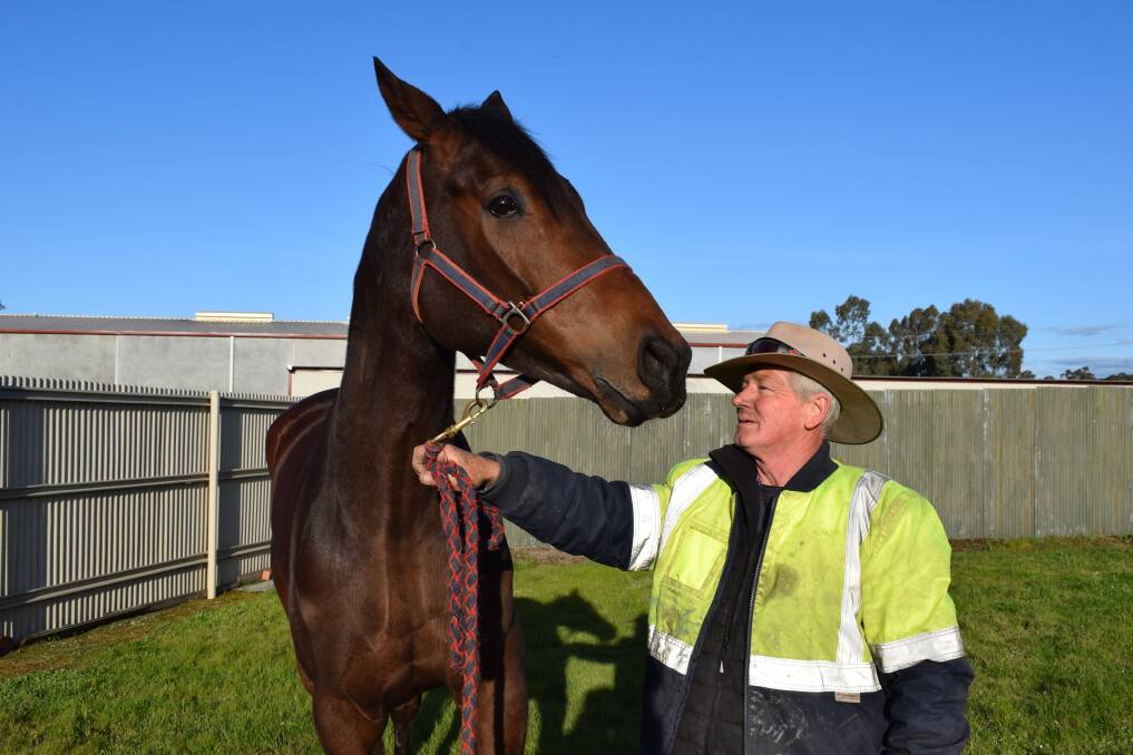 Bendigo hobby trainer Daryn Drust with his six-year-old gelding Cooter Cha Cha. Picture: KIERAN ILES