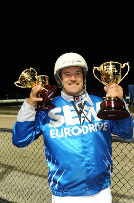 Lance Justice is pictured after his 2011 Bendigo Pacing Cup win with Smoken Up.
