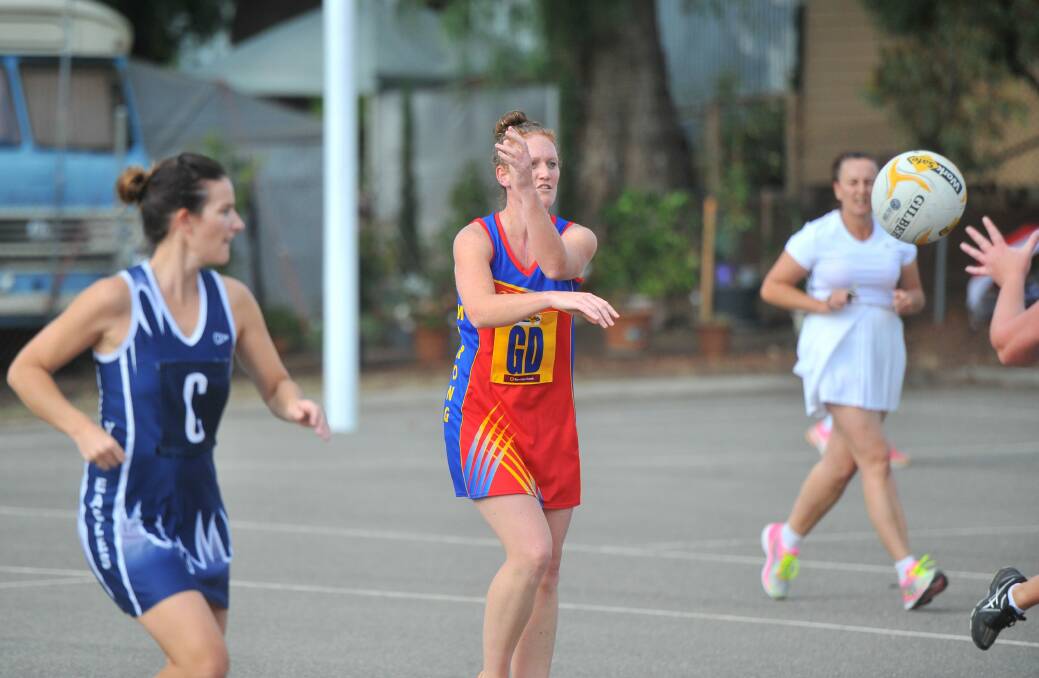 Lions coach Megan Bagnall feeds off a pass in last week's game against YCW. Picture: LUKE WEST