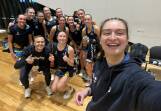 Bendigo Strikers 23-and-under players and coach Jayden Cowling celebrate their first win in the Victorian Netball League. The Strikers defeated fellow newcomers the Western Warriors 54-53.