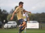 Ryan Merriman shoots for goal during Bendigo City's 6-5 reserves loss against Melton Phoenix on Saturday. Picture: COLIN NUTTALL