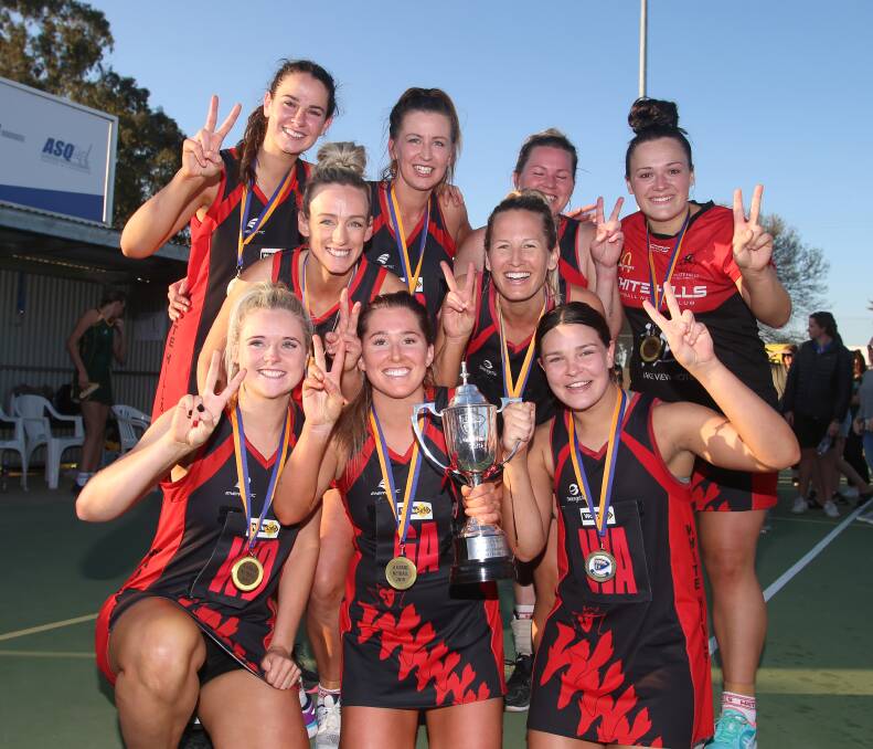 SUCCESS: Ash Gilmore (second from left at back) played in two premierships in two seasons at White Hills.