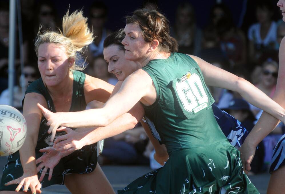 Alicia McGlashan and Simone Andrews look to put a stop on Eaglehawk's Christie Rogers during the 2010 grand final. 