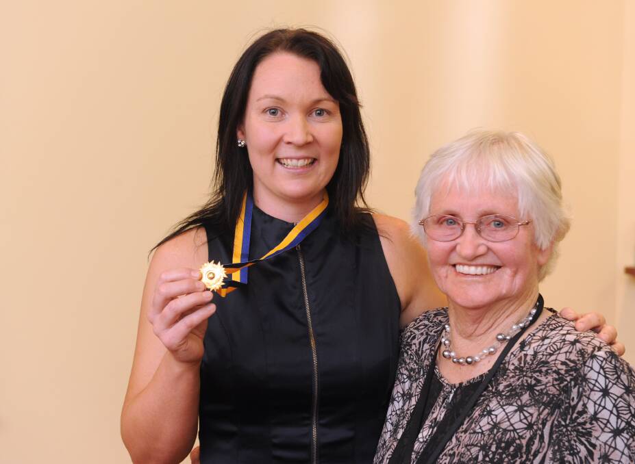 Betty Thompson presents the 2012 Betty Thompson Medal to Kangaroo Flat star Karly Elvey.