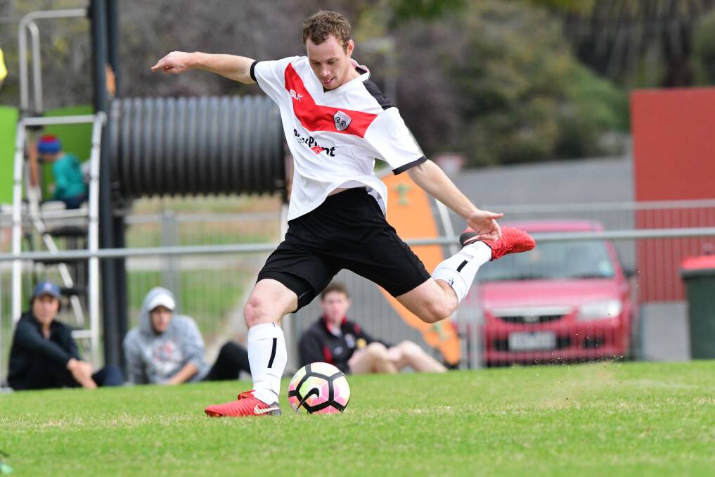 STRIKE: Golden City's Zac Gilmour shoots for goal against Spring Gully on Sunday. Gilmour converted this penatly to help the Rams to a 2-1 win. Pictures: NONI HYETT