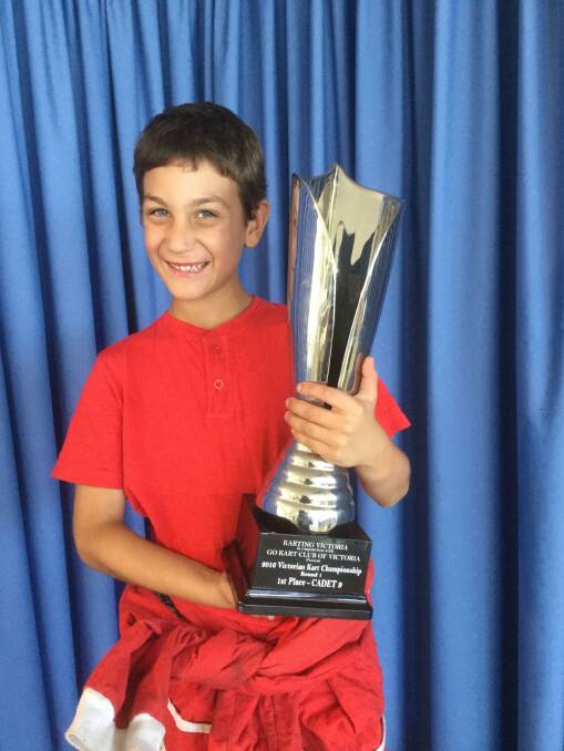 Ayrton Filippi with his trophy for winning round one of the Go Karting Victoria state titles.