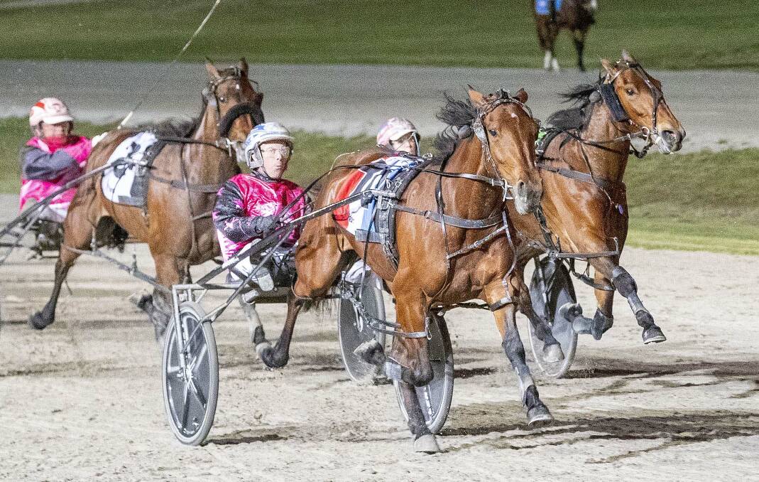 Ladies In Red, driven by David Moran, charges to a brilliant Group 1 Victoria Oaks win at Lord's Raceway on Saturday night. Picture: STUART McCORMICK