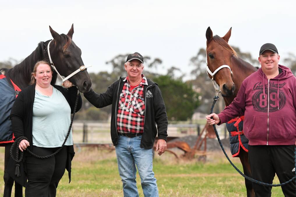 Kristen, Trevor and Nick Patching with Pippa One Two and Busters Grin on their Marong property. The horses have combined to win three races at Lord's Raceway in 13 days. Picture: NONI HYETT