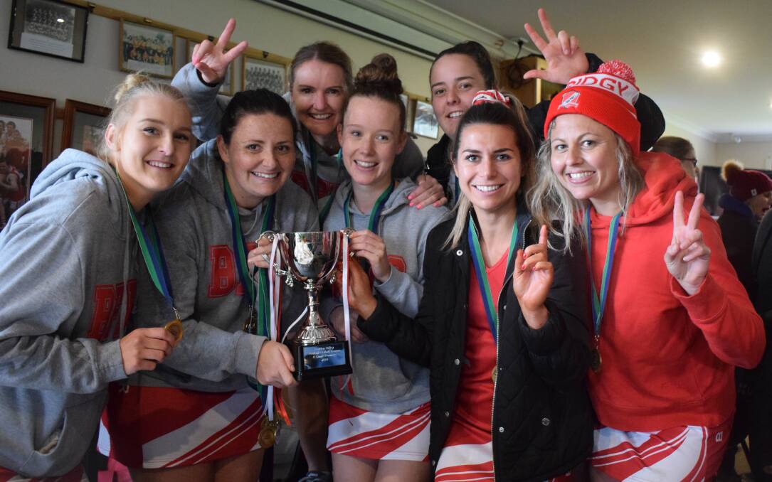 Bridgewater's B-grade netballers celebrate their premiership win on Saturday, minus Ellie Wilson and Brigette Matthews, who were involved in the A-grade game. The Mean Machine have won three B-grade flags in a row. Picture: KIERAN ILES