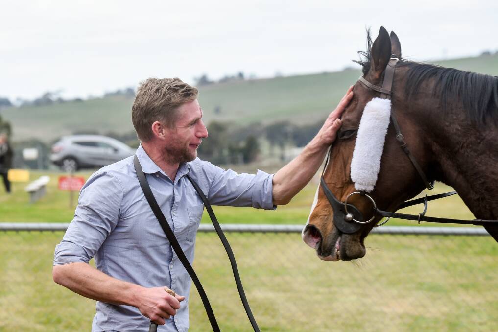 Mr Liberty gets a pat from his Bendigo trainer Nick Smart following their win at Casterton on Saturday. Picture: ALICE LAIDLAW/RACING PHOTOS