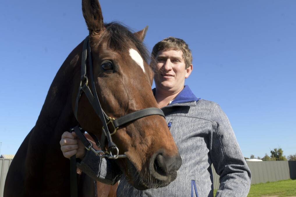 Kym Hann with another of his horses, She's Benficial. Picture: NONI HYETT