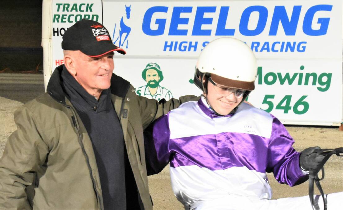 SON OF A GUN: Harness racing legend Jim O'Sullivan congratulates son Sean following his maiden driving win this week. Picture: CLAIRE WESTON PHOTOGRAPHY
