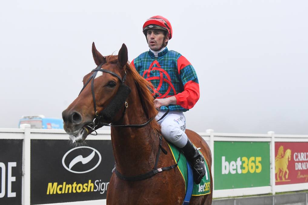 John Robertson returns to the mounting yard after a tough win on Eitilt in the fog at Kilmore on Thursday. Picture: PAT SCALA/RACING PHOTOS