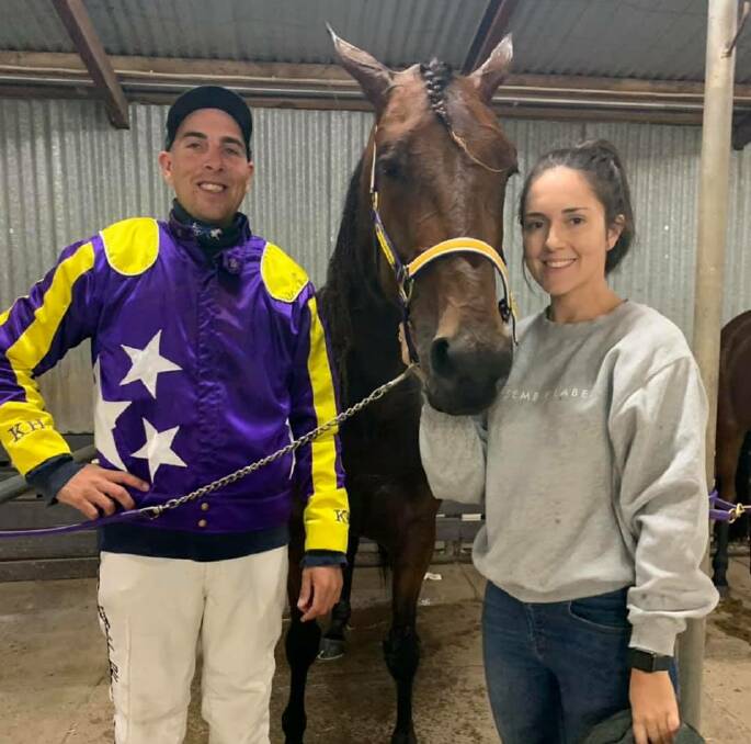 Kate Hargreaves and Josh Duggan with Wisp Of Smoke following the four-year-old trotting mare's win at Geelong on Tuesday night. Picture: GEELONG HARNESS RACING CLUB