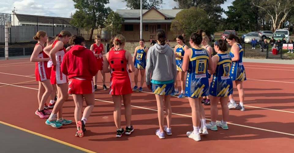 THREE CHEERS: Golden Square and South Bendigo players wish each other luck after Saturday's practice match.