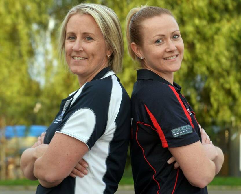 Lauren Rogers (right) with YCW's Christie Griffiths ahead of the 2014 LVFNL A-grade grand final. Picture: BRENDAN McCARTHY