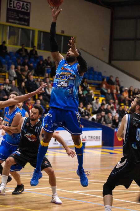 Damian Johnson scores against the Hobart Chargers. Picture: STEVE BLAKE, AKUNA PHOTOGRAPHY
