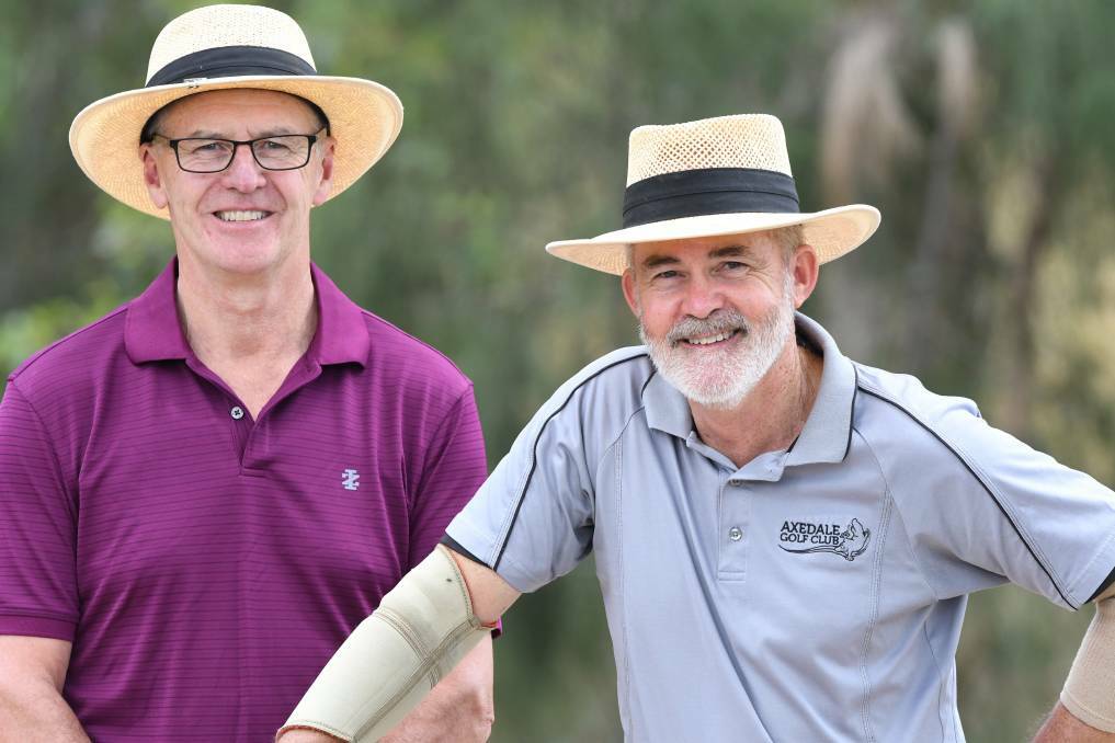 BIG WIN FOR CANCER: Axedale Golf Club's Greg Hamilton and Owen Davies and their club mates have raised more than $3000 for cancer research. Picture: NONI HYETT