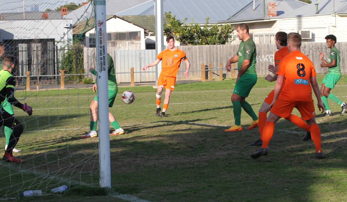 Aidan Lane shoots for goal against Maribyrnong Greens last week. His 11th minute goal gave City an early 2-0 lead.
