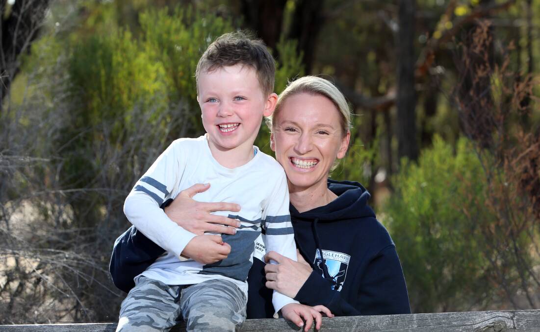 After an injury-interrupted start to the season, Lauren Miller is back on court and loving life at Eaglehawk. She is pictured with son Sam. Picture: GLENN DANIELS