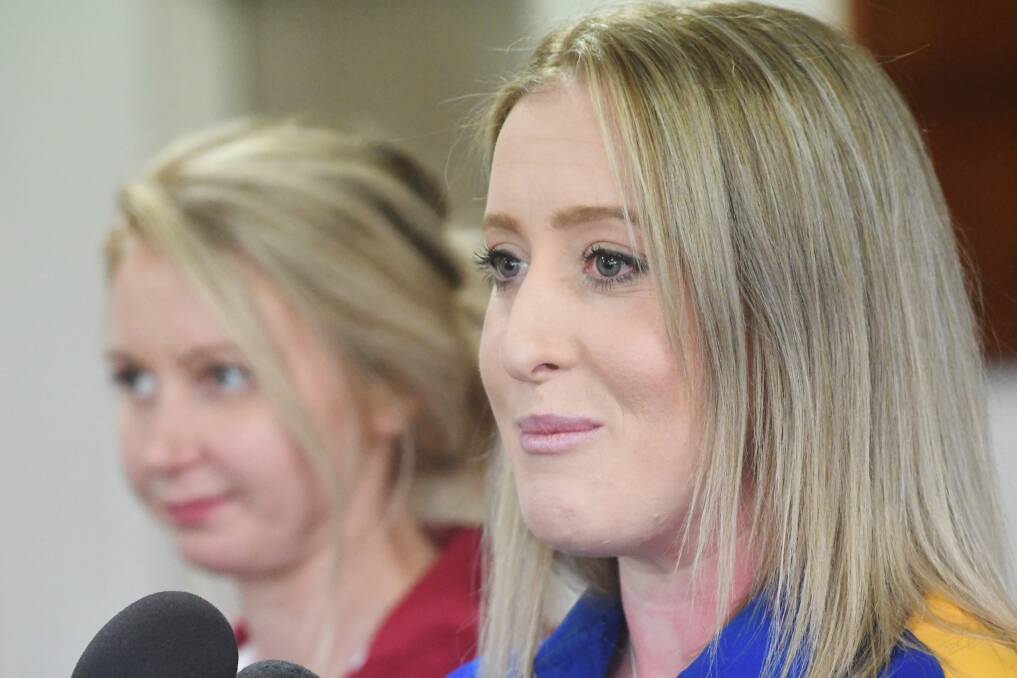 Allira Holmes (front) and Heather Oliver at the pre-grand final press conference.