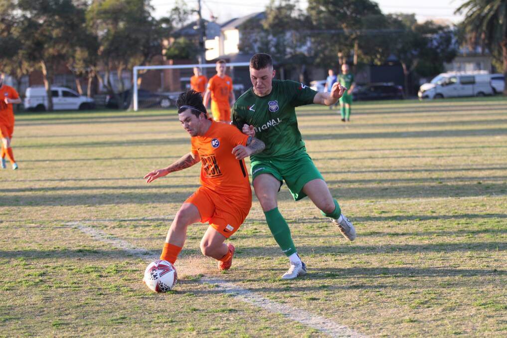 Luke Burns fights for possession during Bendigo City's 4-1 win over Maribyrnong Greens on Saturday. Picture: COLIN NUTTALL