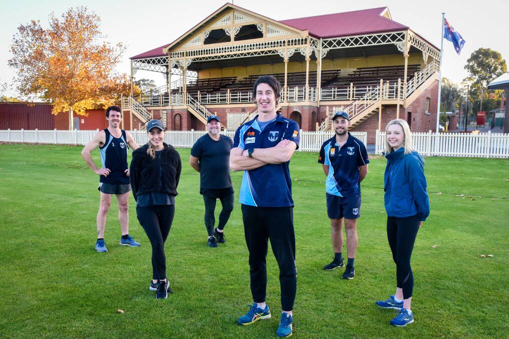 City of Greater Bendigo's Crystie Ballard and Steph Mein, with Eaglehawk Football Netball Club's Henry Miller, Bryce Basillie, Travis Matheson and Brendan Tanner. Picture: BRENDAN McCARTHY