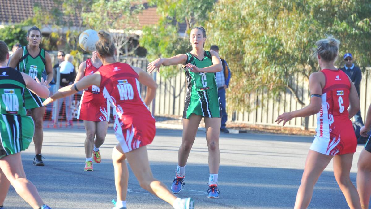 PRECISION PASSING: Kangaroo Flat midcourter Milly Wicks looks to feed the ball to a teammate in Saturday's match against South Bendigo. Picture: LUKE WEST