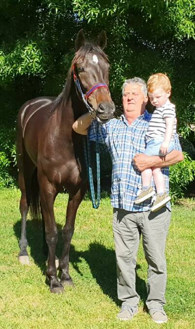 Elmore trainer Keith Cotchin and his grandson Jack with Credit To Chris following Monday's win at Maryborough.