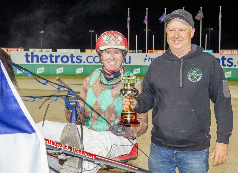 Michael Bellman and Angove stable foreman Paul Clover celebrate success at Tabcorp Park Melton with Sundons Courage. Picture: STUART McCORMICK