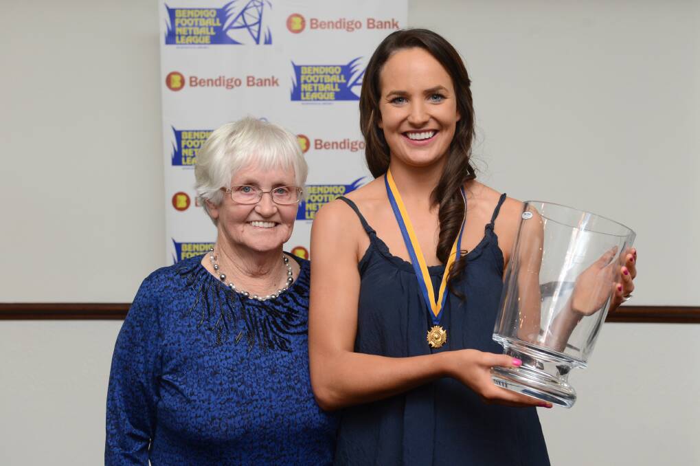 Betty Thompson presents star Gisborne midcourter Tiana Newman with the second of her BFNL league best and fairests, better known as the Betty Thompson Medal - in 2013.