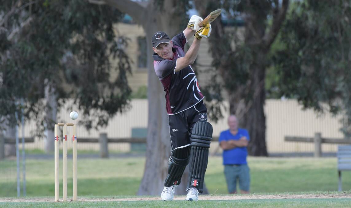 QUICK RUNS: West Bendigo's Mark Burgess hits out in the latter stages of his side's innings against Bendigo United at Ewing Park on Saturday. The Redbacks opened the season with a win. Picture: NONI HYETT